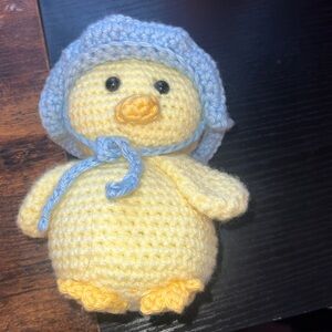 Handcrafted spring chickadee with blu flower bonnet crochet